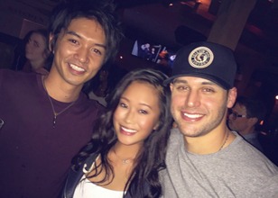 Three friends posing for a photo at a social gathering, highlighting the close-knit bonds of a professional martial arts and taekwondo stunt team.